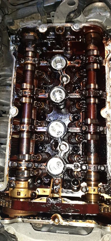engine sludge buildup damaged valve cover