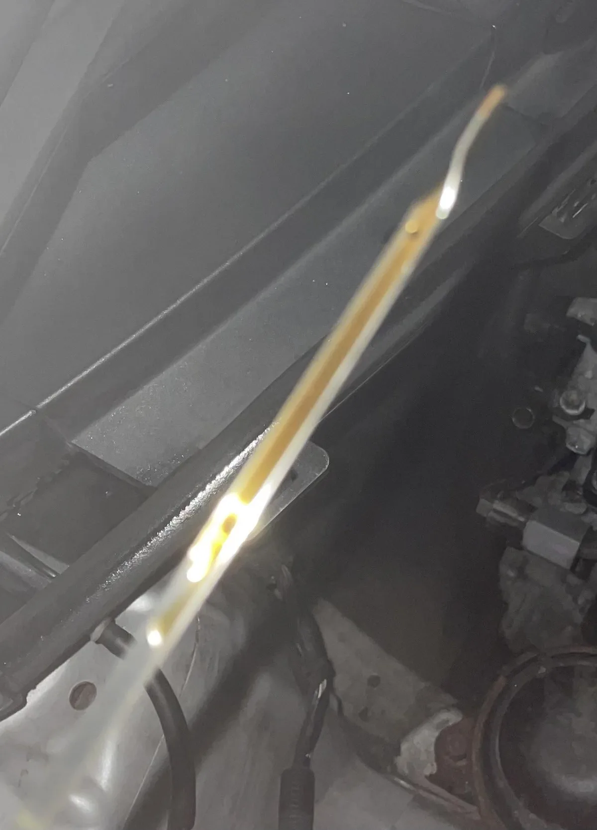 overfilled oil dipstick foamy oil
