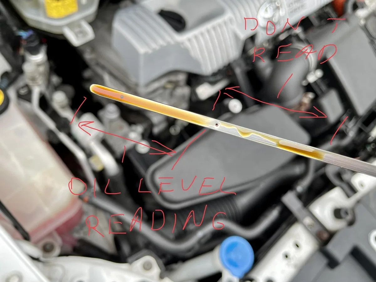 Yaris dipstick oil level reading photo